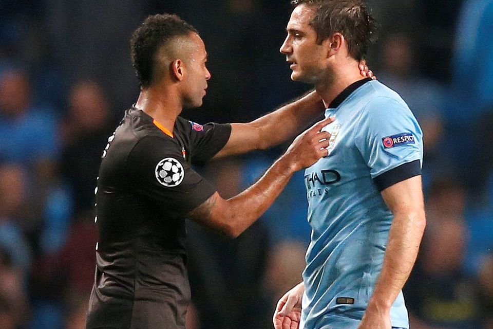 Manchester City's Frank Lampard (R) and AS Roma's Ashley Cole react after their 1-1 Champions League draw