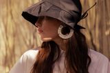 thumbnail: August Night tuck hat in techno taffeta, €95, earrings by Daki Daki Jewellery, linen shirt from Jennifer Slattery. Photo: Mark Hill