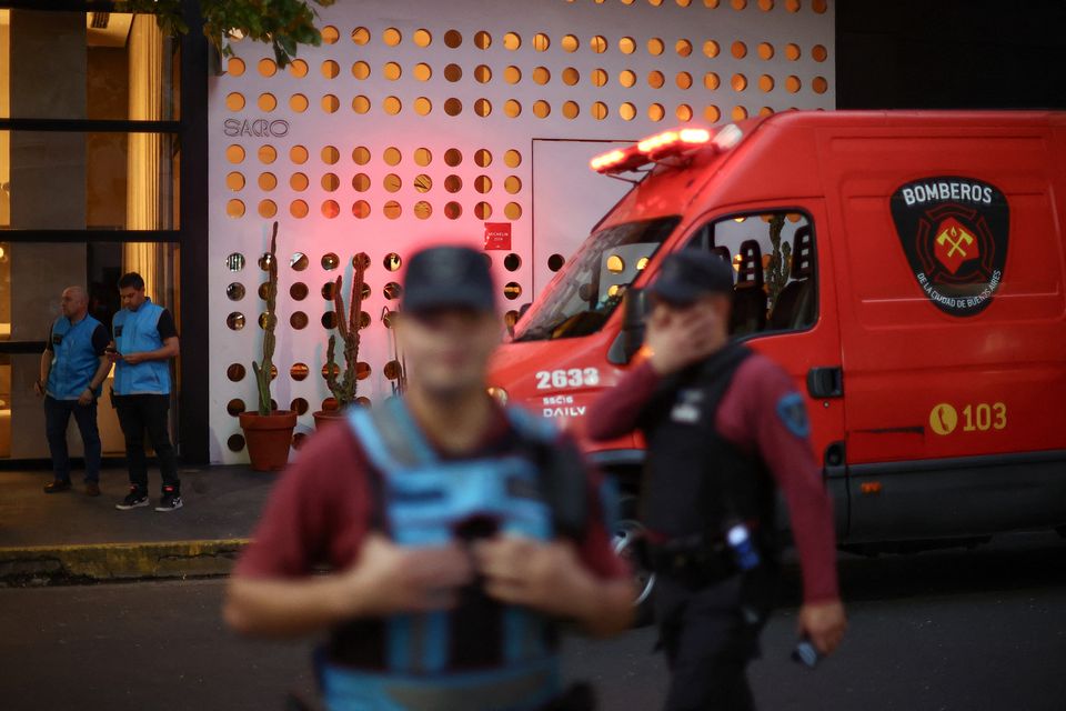 First responders work outside the hotel where Liam Payne, former One Direction member, was found dead, in Buenos Aires, Argentina, October 16, 2024. REUTERS/Agustin Marcarian.