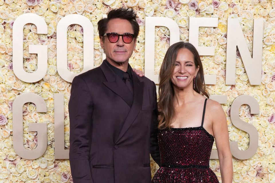 Robert Downey Jr., left, and Susan Downey arrive at the 81st Golden Globe Awards on Sunday, Jan. 7, 2024, at the Beverly Hilton in Beverly Hills, Calif. (Photo by Jordan Strauss/Invision/AP)