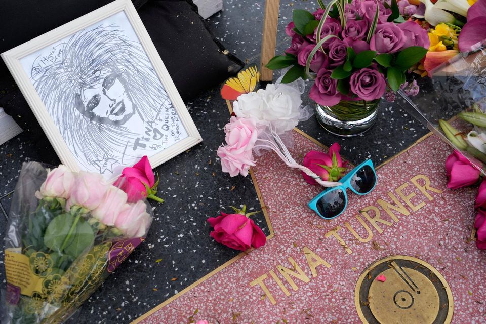 Flowers and a portrait of the late singer Tina Turner surround her star on the Hollywood Walk of Fame in Los Angeles. Photo: AP