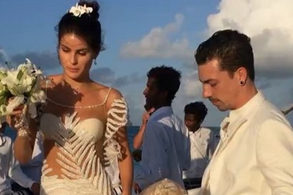Brazilian super model Isabeli Fontana wore a barely-there designer gown for her wedding to singer Diego Ferrer