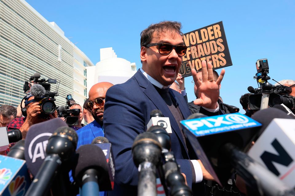 George Santos speaks to reporters after leaving court in New York today. Photo: Michael M Santiago / Getty