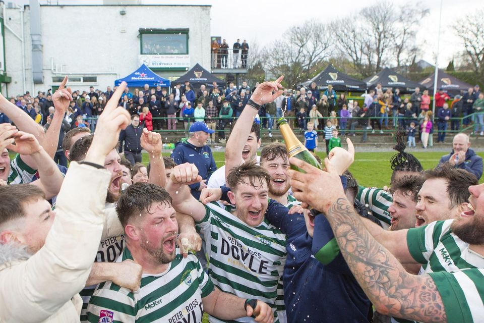 The Greystones players celebrate after defeating Galway Corinthians at Dr. Hickey Park.