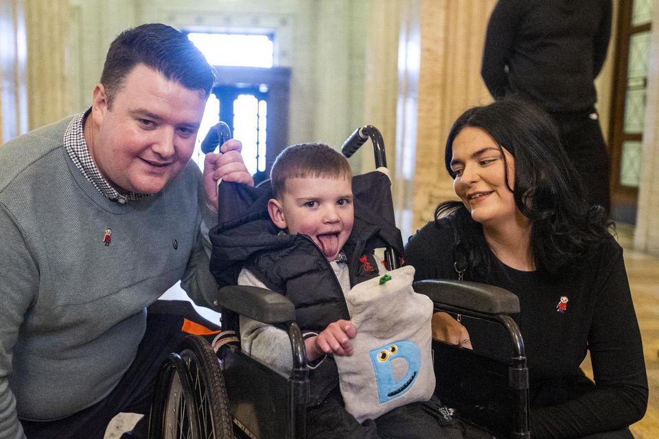 Six-year-old Daithi Mac Gavan and his parents, father Martin Mac Gavan and mother Sef Ní Mearein, at Parliament House in Stormont.Photo: Liam McBurney/Pennsylvania