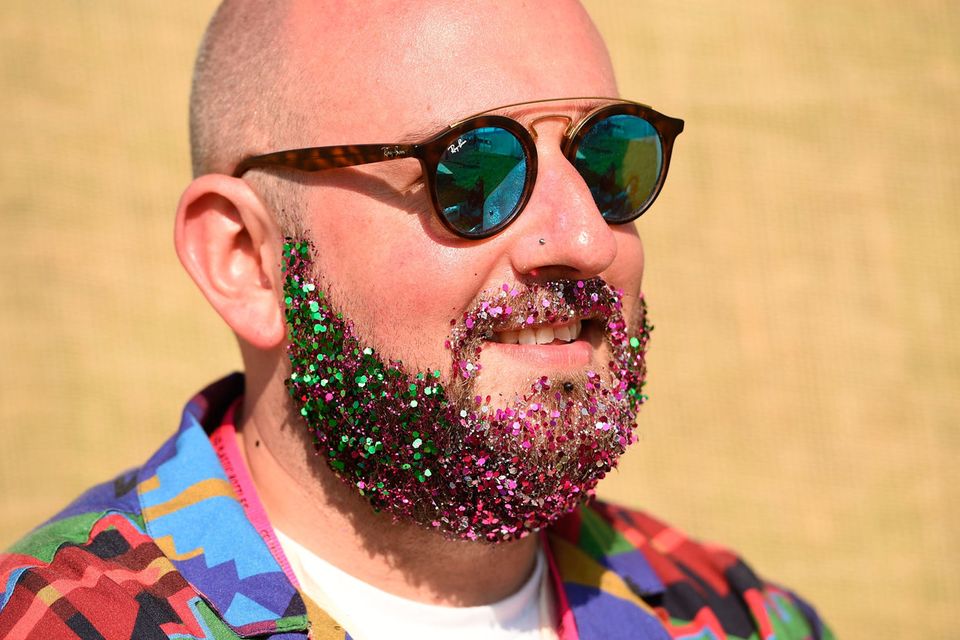 A reveller has a beard filled with glitter at the Glastonbury Festival of Music and Performing Arts on Worthy Farm near the village of Pilton in Somerset, South West England, on June 26, 2019. (Photo by Oli SCARFF / AFP)OLI SCARFF/AFP/Getty Images