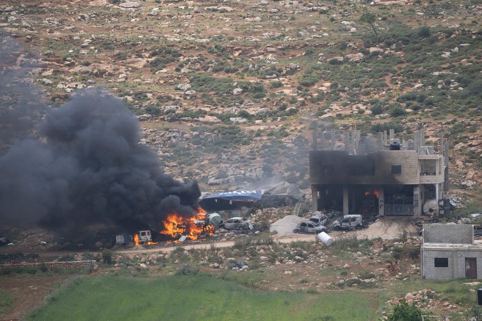 Properties of Palestinian villagers set on fire by Israeli settlers in the West Bank village of al-Mughayyir. Photo: AP
