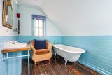 thumbnail: One of the property's ensuite bathrooms.