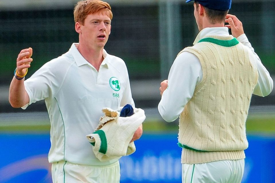 Craig Young (left) congratulates his Ireland teammate George Dockrell taking the catch to clinch victory in their InterContinental Cup clash with the United Arab Emirates at Malahide. Photo: Seb Daly / SPORTSFILE