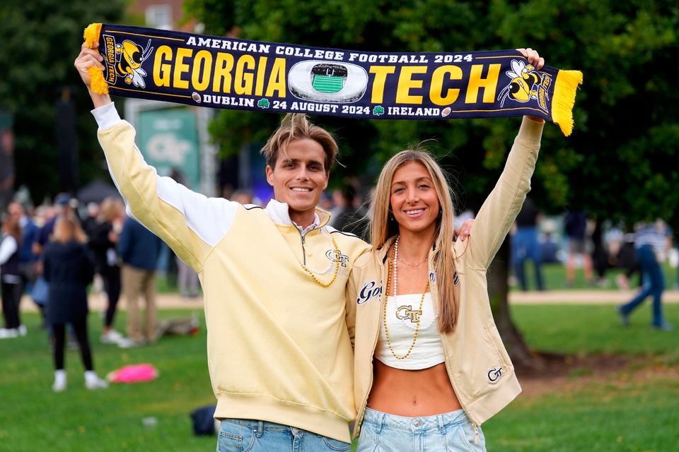 Georgia Tech fans Jake Wiggins (left) and Makena Thomas attend the Georgia Tech Helluva Block Party Pep Rally in Merrion Square, Dublin, as part of the build up to Saturday’s Aer Lingus College Football Classic, US College football match in Dublin. Photo: Brian Lawless/PA Wire