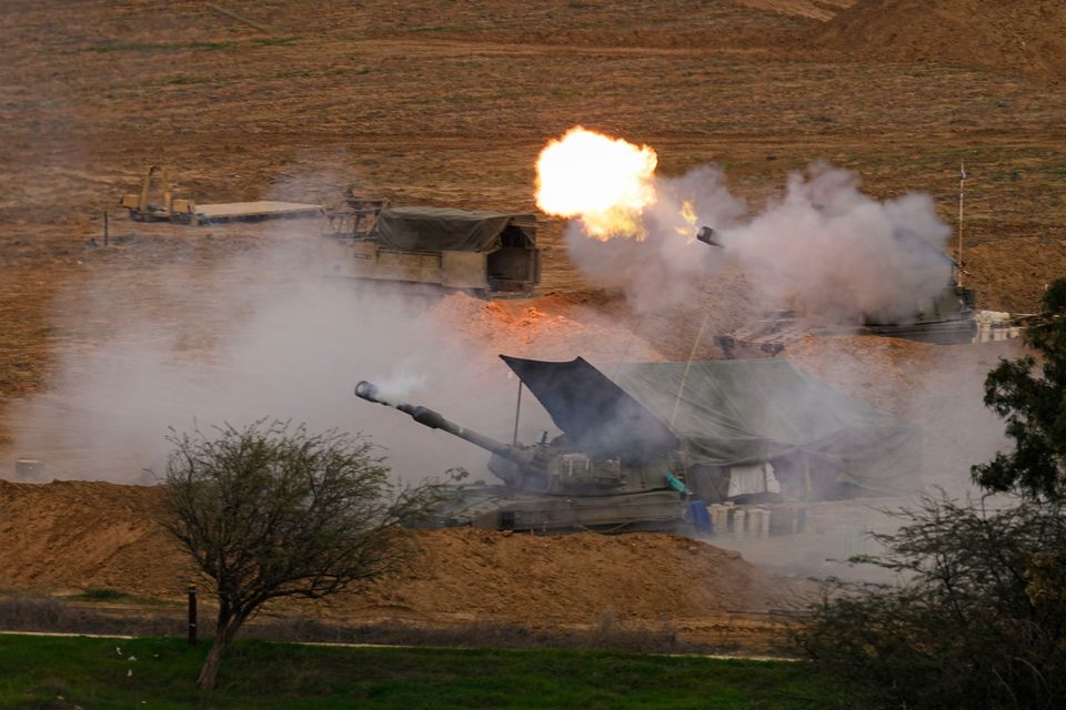 An Israeli mobile artillery unit fires a shell from southern Israel towards the Gaza Strip, in a position near the Israel-Gaza border on Thursday, Dec. 28, 2023. (AP Photo/Ohad Zwigenberg)