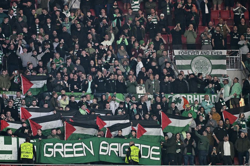 Celtic fans hold up Palestinian flags during the UEFA Champions League Group E football match between Atletico Madrid and Celtic at Civitas Metropolitano Stadium in Madrid, Spain on November 07, 2023. (Photo by Burak Akbulut/Anadolu via Getty Images)