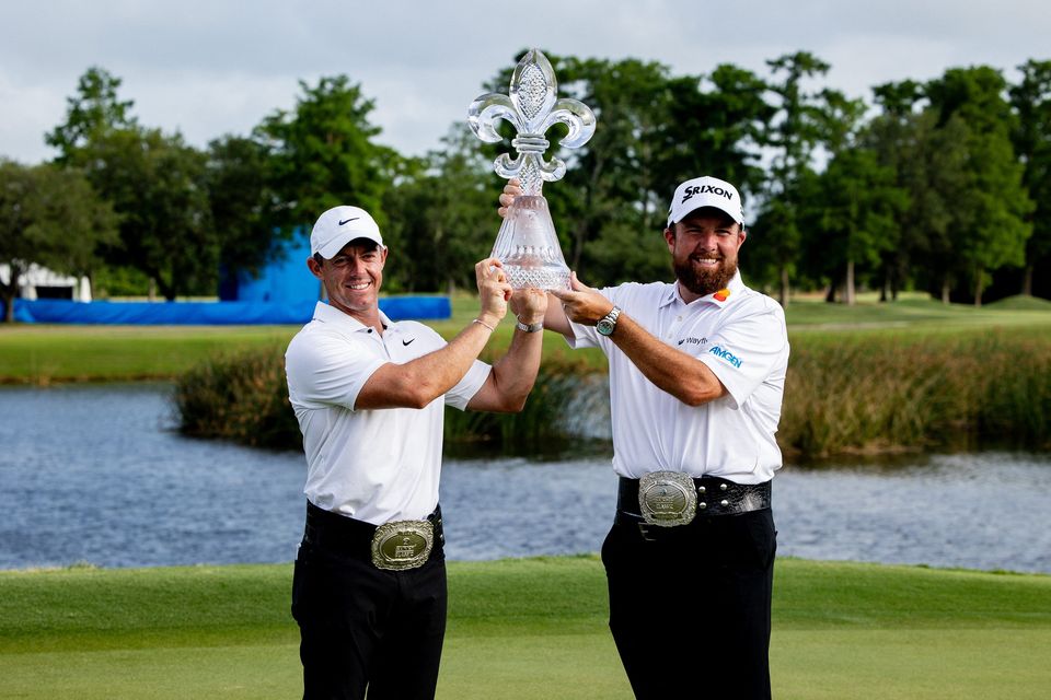 Rory McIlroy  and Shane Lowry pose for fans and the media after winning the Zurich Classic of New Orleans golf tournament. Photo: Stephen Lew-USA Today Sports