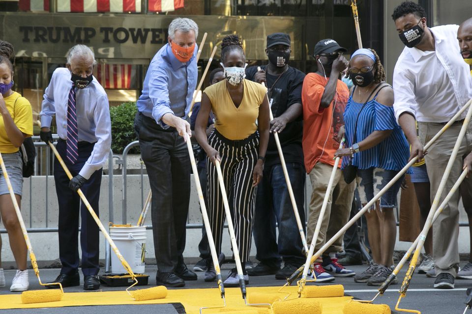 Mayor Bill de Blasio participates in painting Black Lives Matter on Fifth Avenue (Mark Lennihan/AP)
