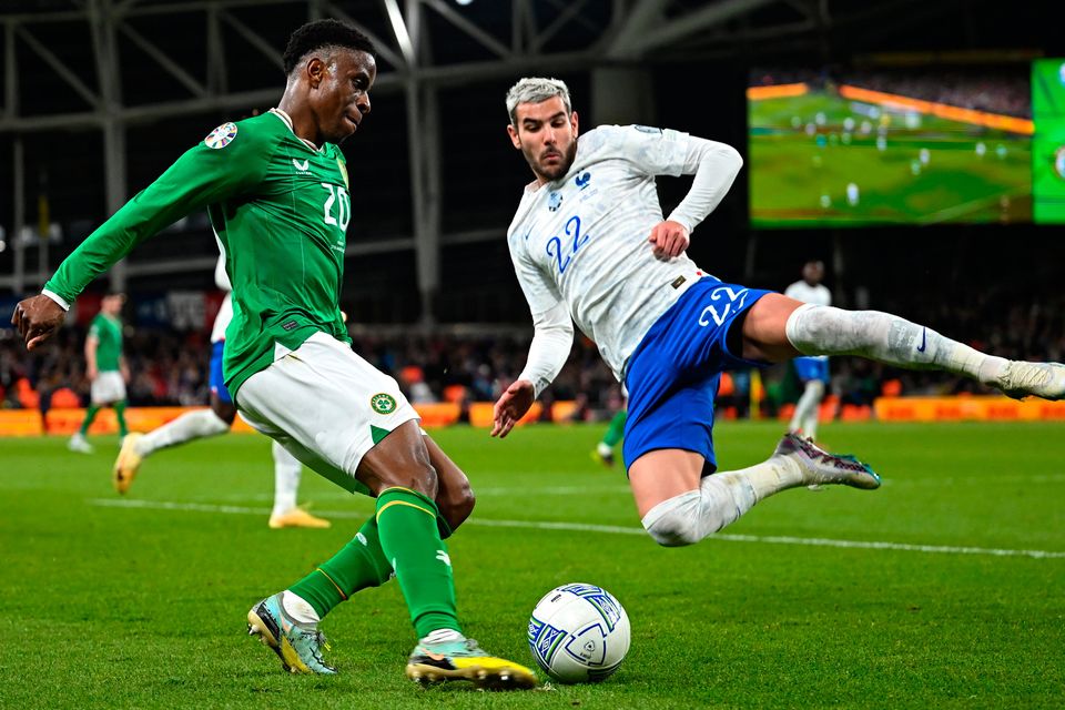 Ireland's Chiedozie Ogbene in action against Theo Hernández of France during the Euro 2024 qualifier against France at Aviva Stadium in Dublin. Photo by Stephen McCarthy/Sportsfile