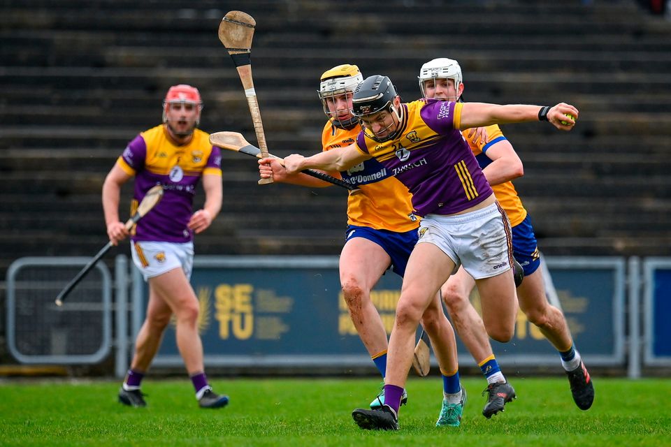 Wexford's Jack O'Connor in action against Clare's Seán Rynne, left, and Cian Galvin during their Allianz HL Division 1 Group A tie at Chadwicks Wexford Park. Photo: Seb Daly/Sportsfile