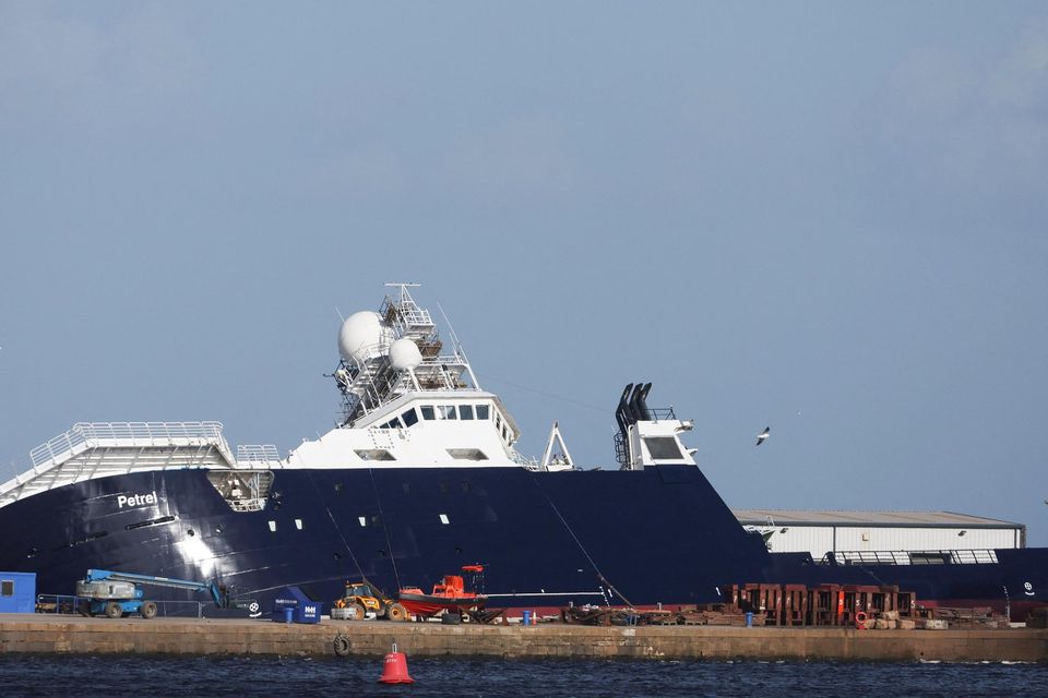 The research vessel Petrel lists at an angle in a dry dock in Leith, near Edinburgh. Photo: Russell Cheyne/Reuters