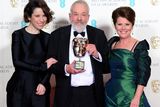 thumbnail: Mike Leigh with the Fellowship Award, alongside Sally Hawkins and Imelda Staunton (right), at the EE British Academy Film Awards at the Royal Opera House, Bow Street in London. PRESS ASSOCIATION Photo. Picture date: Sunday February 8, 2015. See PA story SHOWBIZ Bafta. Photo credit should read: Dominic Lipinski/PA Wire