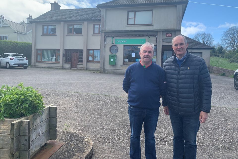 Paidí Breathnach local Spar owner with Matt Shanahan TD outside the closing Post Office in An Rinn, Baile Na nDéise