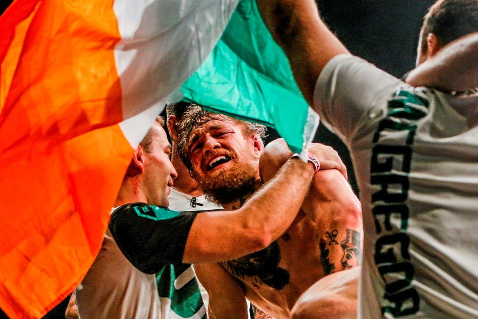 Conor McGregor celebrates with team-mate Artem Lobov after defeating Chad Mendes. Photo: Esther Lin / Sportsfile