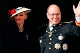 thumbnail: Prince Albert II of Monaco (R) and Princess Charlene of Monaco (L) appear on the balcony of the Monaco Palace during the celebrations marking Monaco's National Day