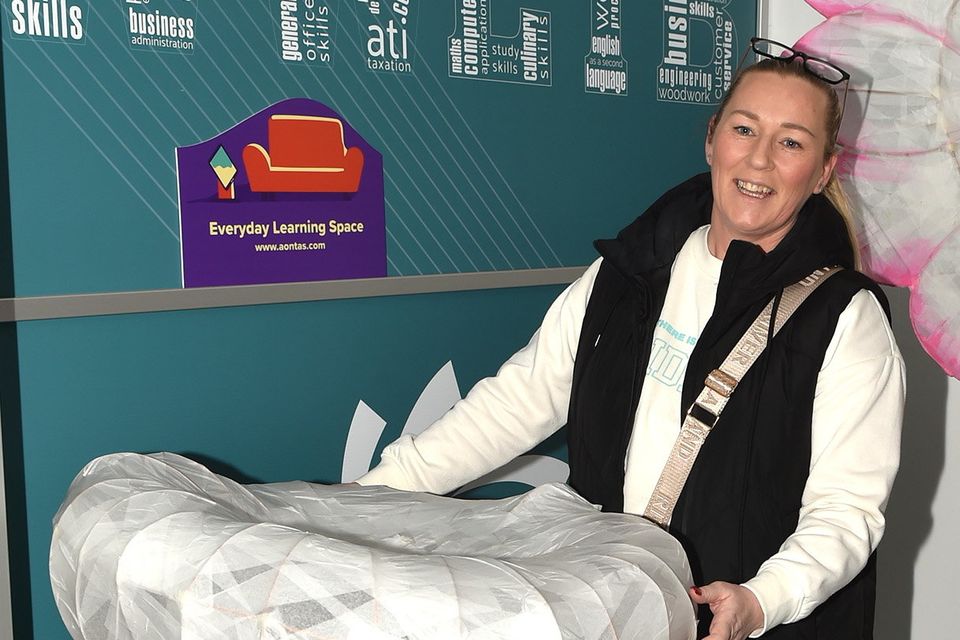 Karen Kenny with her work 'The Mushroom' at the opening of the art exhibition entitled 'Lightening up our everyday learning spaces' as part of the AONTAS Adult Learner Festival in the Gorey Institute of Further Learning and Training Centre on Thursday. Pic: Jim Campbell