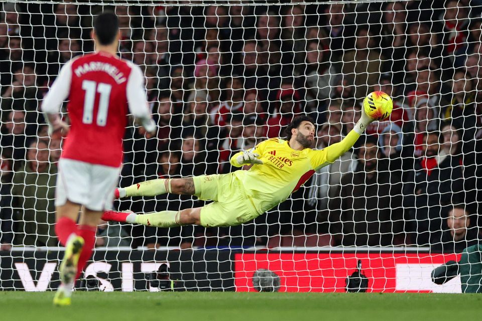 Arsenal's David Raya stretches to make a save during the Premier League tie against Chelsea at Emirates Stadium.