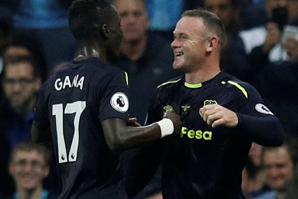 Wayne Rooney celebrates scoring their first goal with Idrissa Gueye