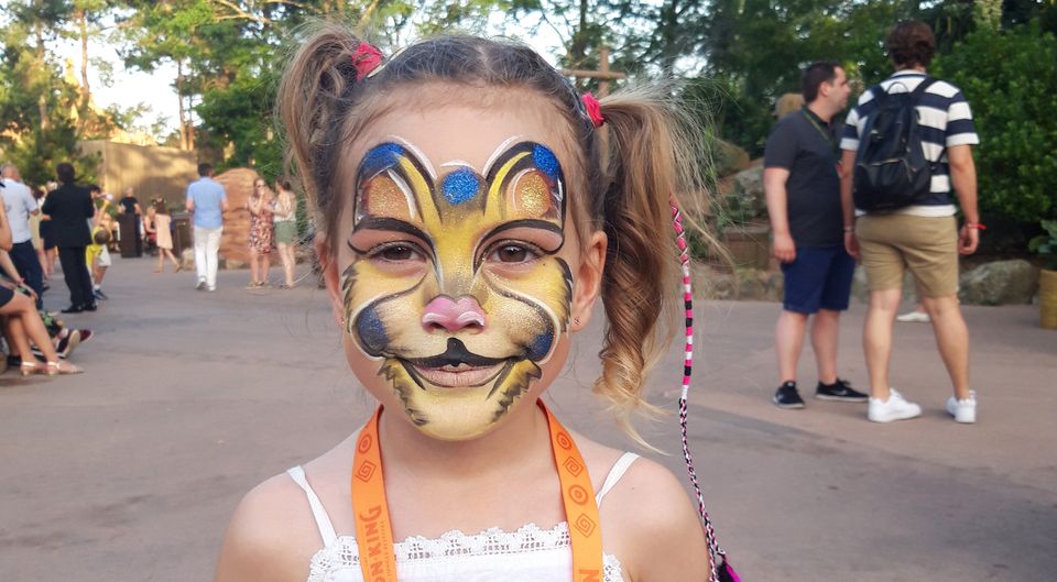 Giorgia proudly poses after having her face painted