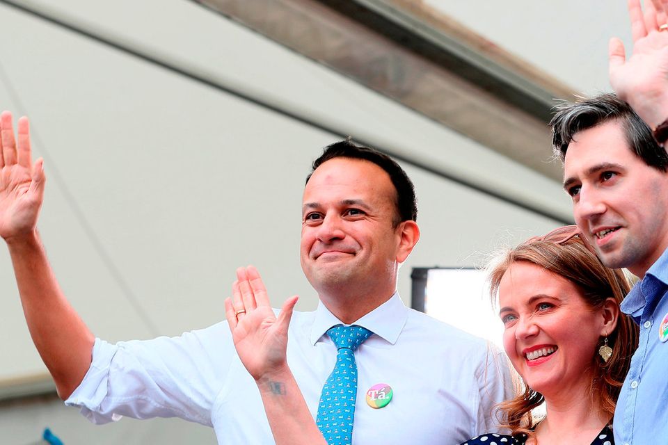 An Taoiseach Leo Varadkar (left), Minister for Health Simon Harris and Senator Catherine Noone wave to the crowd at Dublin Castle. Photo: Brian Lawless/PA Wire