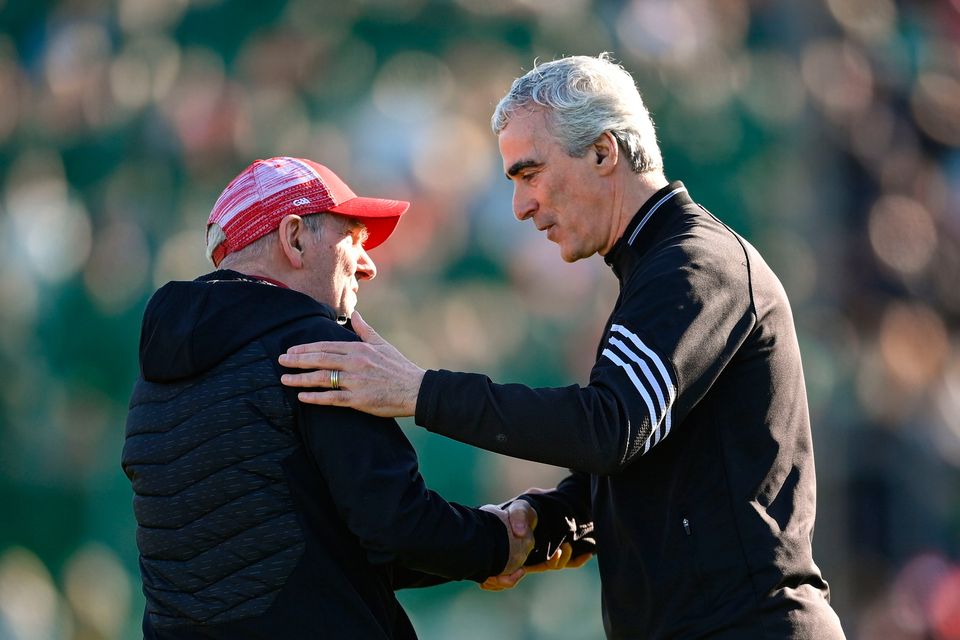Donegal manager Jim McGuinness and Derry boss Mickey Harte shake hands before their Ulster SFC clash