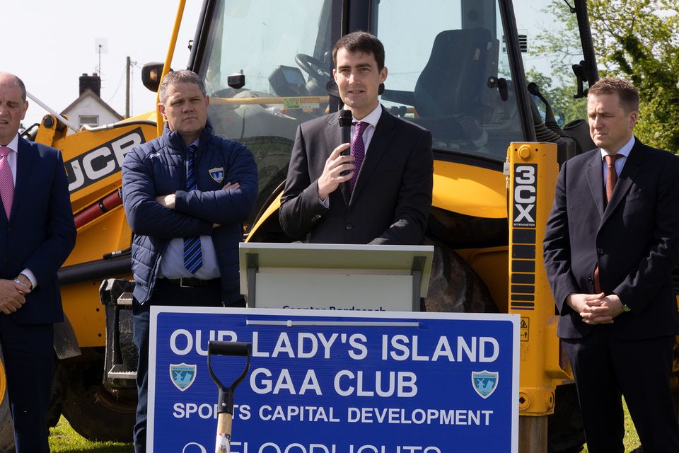 On Thursday morning in Our Lady's Island GAA at the sod turning for astro turf flood lighting and  hurling wall were pupils  from Scoil Mhuire Broadway who cheered on as Sean Pettit, Minister James Browne TD and Minister Jack Chambers  TD turned the sod.
Minister Jack Chambers speaking.