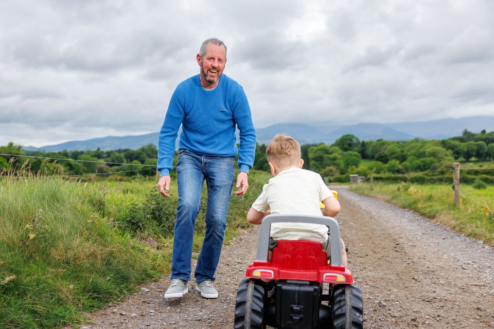 Patrick Meade with his son Reigan (4), who he hoped would be able to attend their local school. Photo: Mark Condren