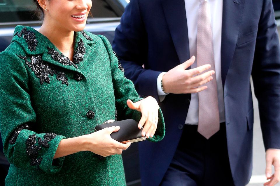 Heavily pregnant Meghan Markle debuts show-stopping Erdem coat for visit to  Canada House