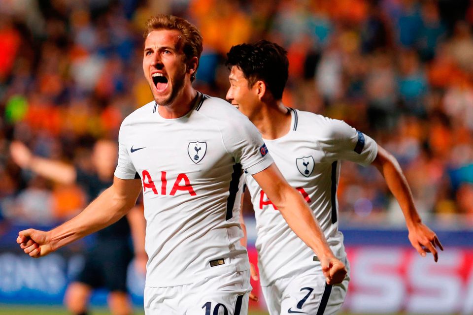 Tottenham Hotspur's English striker Harry Kane (L) celebrates after scoring during the UEFA Champions League football match between Apoel FC and Tottenham Hotspur at the GSP Stadium in the Cypriot capital, Nicosia on September 26, 2017.  / AFP PHOTO / Florian CHOBLETFLORIAN CHOBLET/AFP/Getty Images