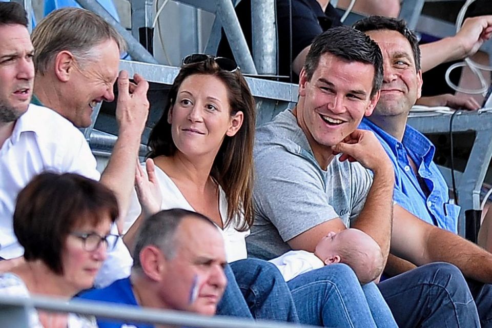 Jonathan Sexton and his wife Laura, with son Luca, share a joke with Joe Schmidt during the Women's Rugby World Cup in France. Picture credit: Aurélien Meunier / SPORTSFILE