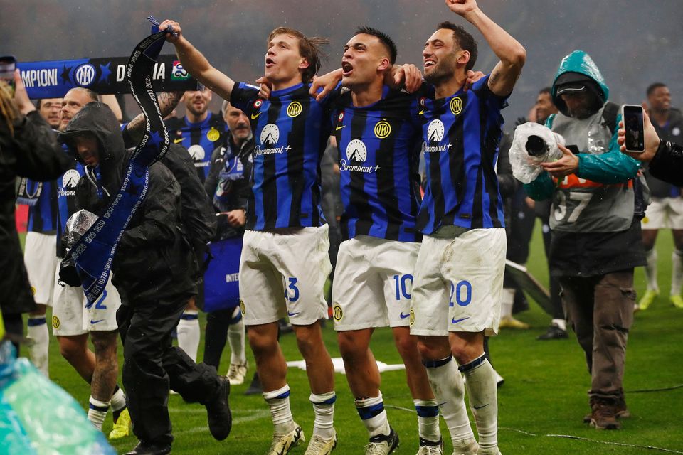 Inter Milan's Nicolo Barella, Lautaro Martinez and Hakan Calhanoglu celebrate