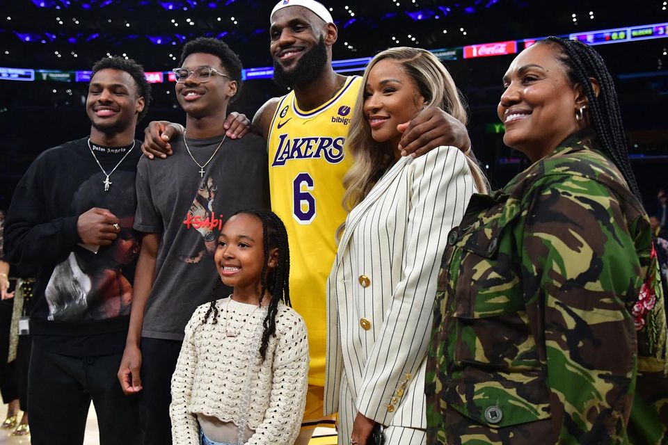 Los Angeles Lakers forward LeBron James (6) poses for photos with his sons Bronny and Bryce Maximus, daughter Zhuri, wife Savannah and mother Gloria after the game against the Oklahoma City Thunder at Crypto.com Arena. Photo: Gary A. Vasquez/USA TODAY Sports