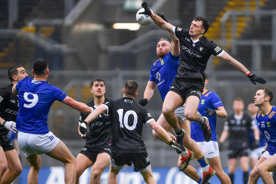 Eoin Murtagh of Wicklow and Cian Lally of Sligo contest a high ball during the Allianz Football League Division 4 Final match between Sligo and Wicklow at Croke Park in Dublin.