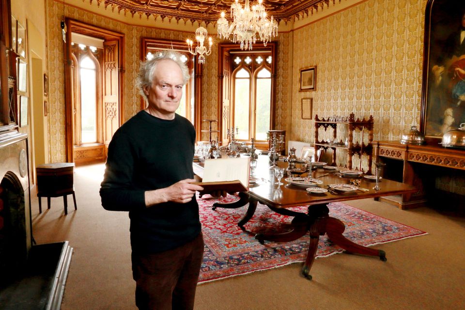 Architectural historian Peter Pearson in the dining room at Johnstown Castle, Co Wexford. The painting over the sideboard is by ET Parris and shows Hamilton Knox Grogan-Morgan, his wife Sophia and daughter. Much of the contents were sourced from auction houses or from the original auction of house contents in 1944