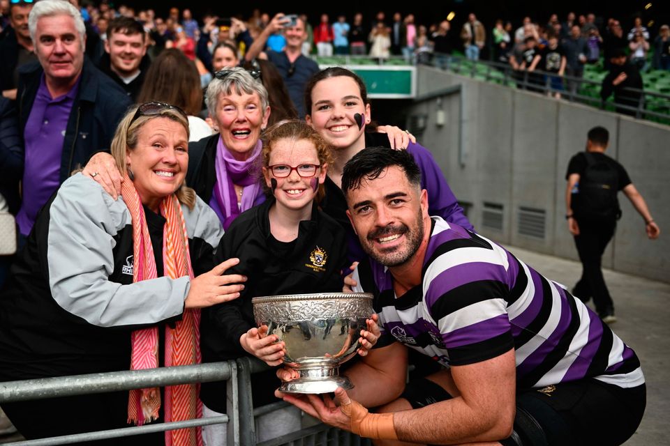 Jordan Coghlan of Terenure with the trophy after his side's victory in the Energia All-Ireland League Men's Division 1A final at the Aviva Stadium last July. Photo: Harry Murphy/Sportsfile