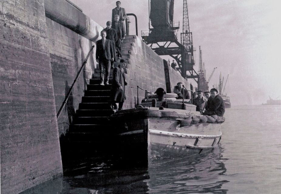 Liffey Ferry Number 4 collecting dock workers in Dublin (archival photo)