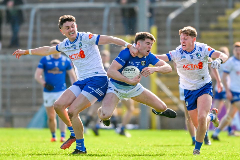 Cian Reilly of Cavan in action against Monaghan's Gary Mohan, left, and Michael Hamill, right, during the Ulster SFC preliminary round match in Clones. Photo: Daire Brennan/Sportsfile