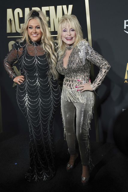 Priscilla Block, left, and Dolly Parton arrive at the awards (Jeffrey McWhorter/AP)