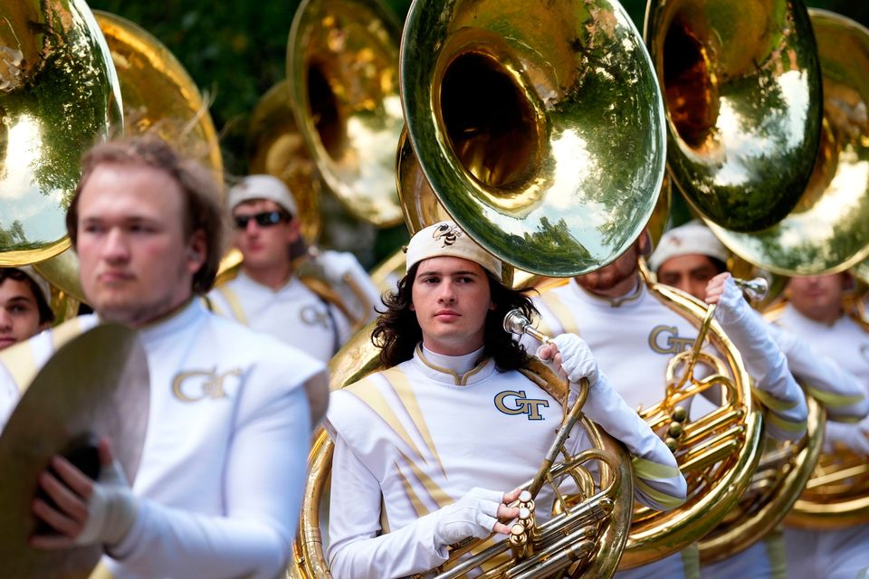 The Georgia Tech Yellow Jacket marching band arrives in Merrion Square, Dublin, to perform at the Georgia Tech Helluva Block Party Pep Rally as part of the build up to Saturday’s Aer Lingus College Football Classic, US College football match in Dublin. Photo: Brian Lawless/PA Wire