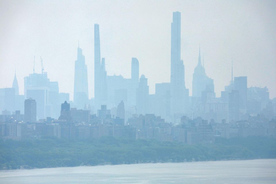 Haze and smoke caused by wildfires in Canada linger over Manhattan. Photo: Reuters/Mike Segar