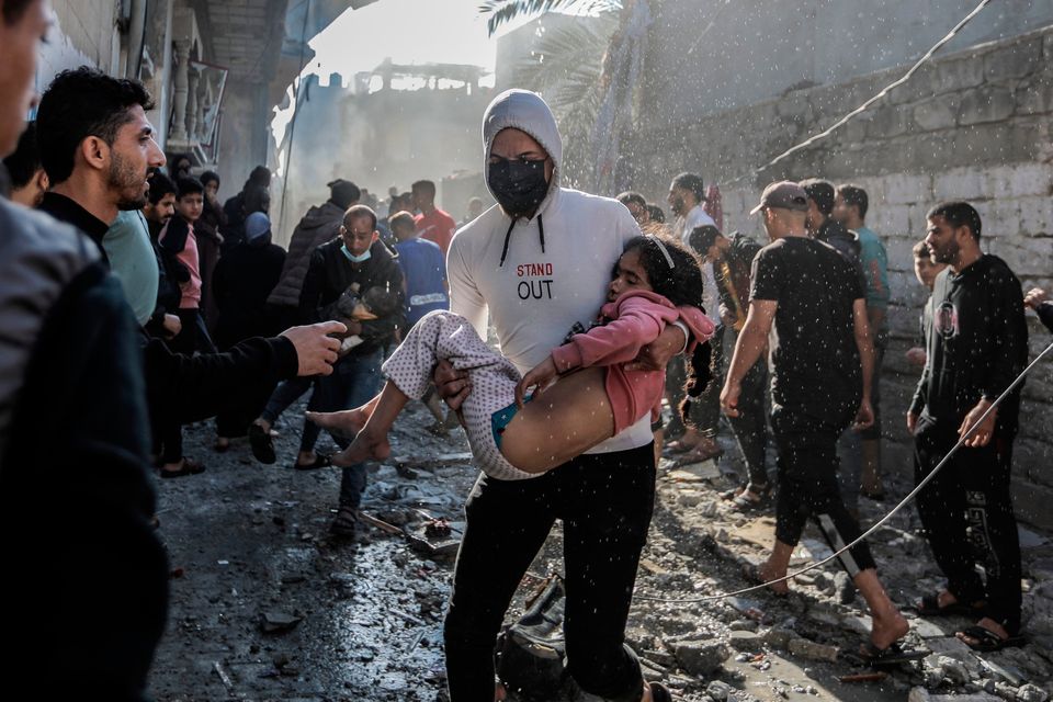 People search through buildings, destroyed during Israeli raids a day earlier, in the southern Gaza Strip on November 17, 2023 in Khan Yunis, Gaza. (Photo by Ahmad Hasaballah/Getty Images)