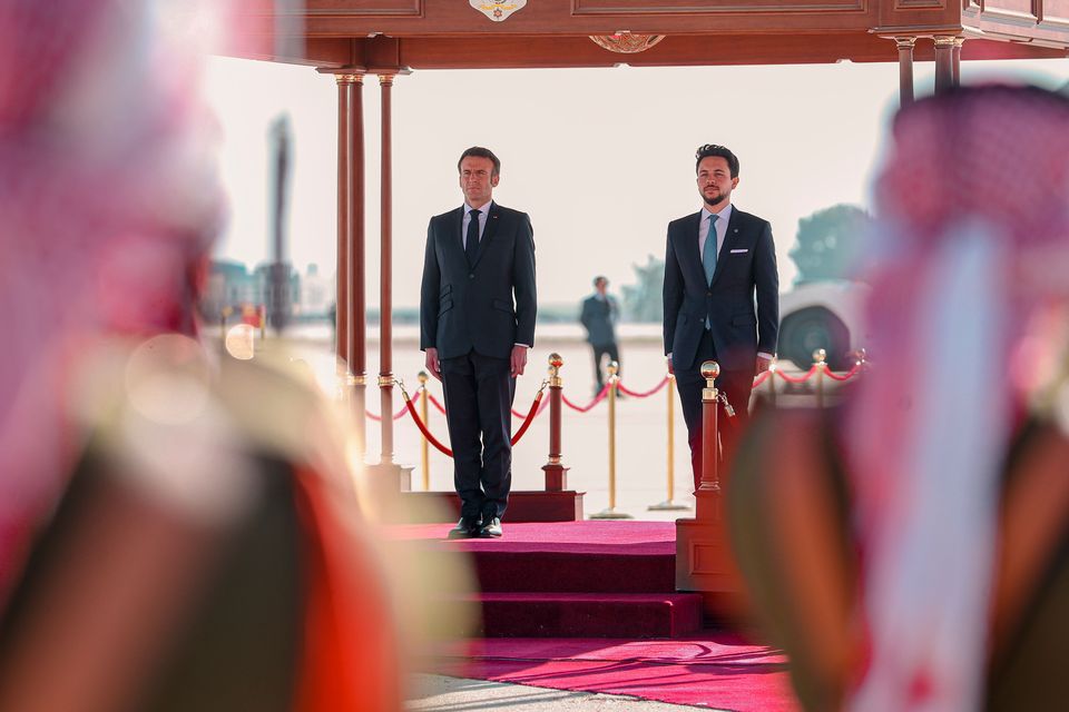 Jordan’s Crown Prince Hussein and French President Emmanuel Macron attend a welcome ceremony at the airport in Amman, Jordan (The Royal Hashemite Court via AP/PA)