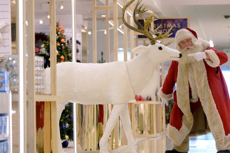 Father Christmas next to a reindeer as Selfridges open their Christmas shop at the flagship store on Oxford Street, London