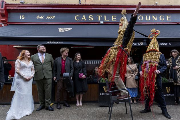 Dublin city centre wedding brings back old Irish tradition with appearance of straw boys